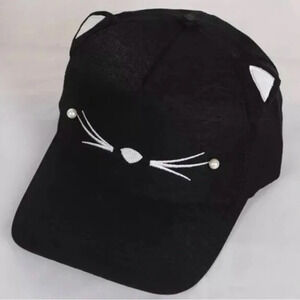 Cat ball cap in black and white - one size. New in package!